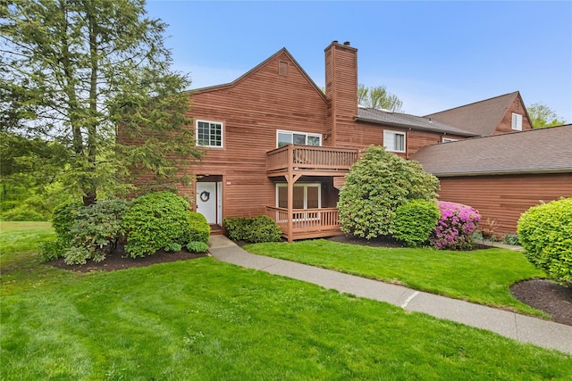 405 Driftway Ln, Brewster, NY 10509 - view of front of property with a chimney, a balcony, and a front lawn