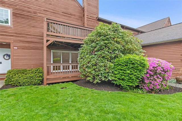 405 Driftway Ln, Brewster, NY 10509 - view of exterior entry featuring a lawn, a chimney, and a balcony