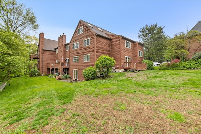 405 Driftway Ln, Brewster, NY 10509 - back of house with a yard, a deck, and a chimney