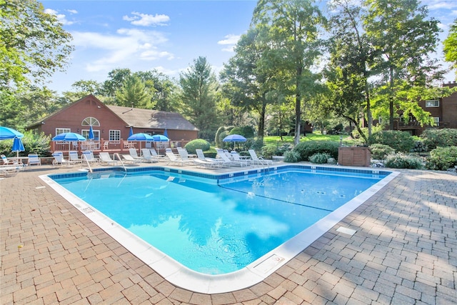 405 Driftway Ln, Brewster, NY 10509 - community pool featuring a patio and view of scattered trees