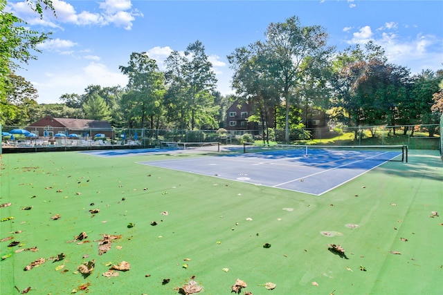 405 Driftway Ln, Brewster, NY 10509 - view of tennis court featuring fence and view of wooded area