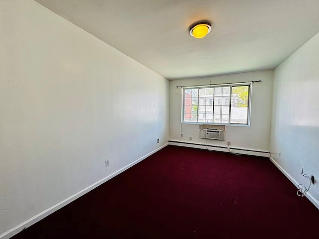 empty room featuring baseboards, a wall unit AC, baseboard heating, and dark colored carpet