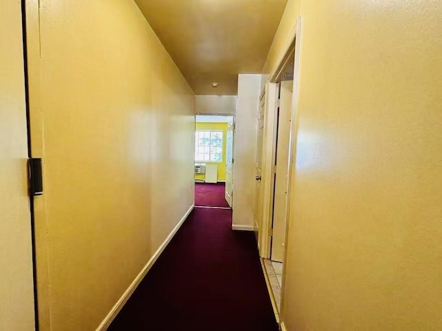 hallway featuring baseboards