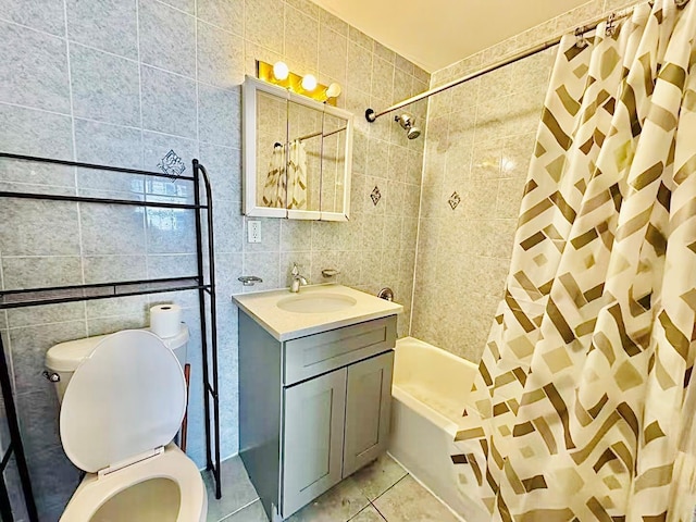 full bathroom with shower / tub combo, tile patterned floors, toilet, and tile walls