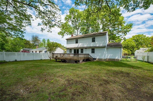 48 Crocus Ln, Commack, NY 11725 - rear view of house with a deck and a chimney
