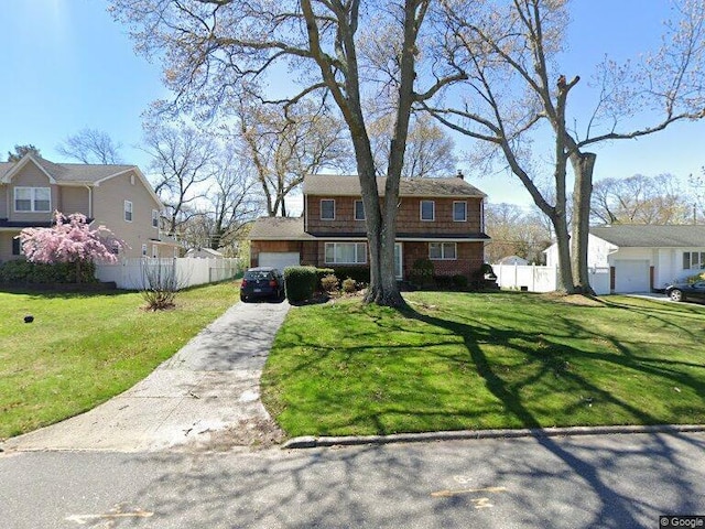 48 Crocus Ln, Commack, NY 11725 - view of front facade with driveway, a residential view, a chimney, and an attached garage