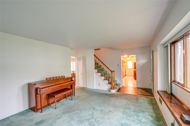 48 Crocus Ln, Commack, NY 11725 - unfurnished room featuring healthy amount of natural light, stairs, and carpet