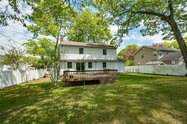 48 Crocus Ln, Commack, NY 11725 - back of house featuring a deck and a chimney