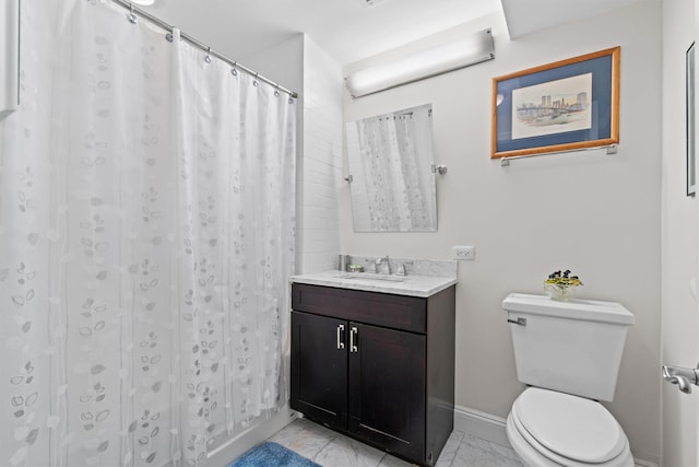 full bath with baseboards, toilet, and vanity