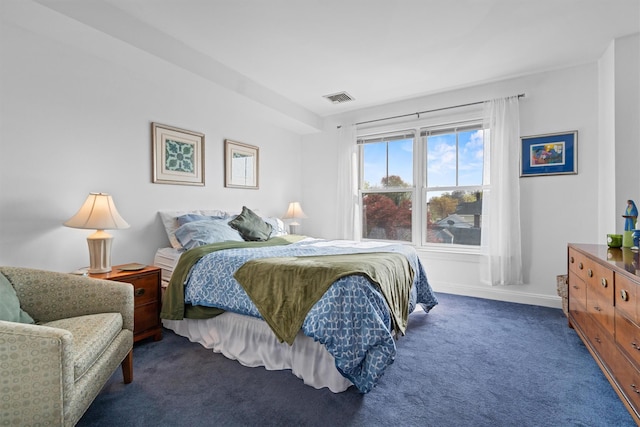 bedroom with visible vents, baseboards, and dark colored carpet