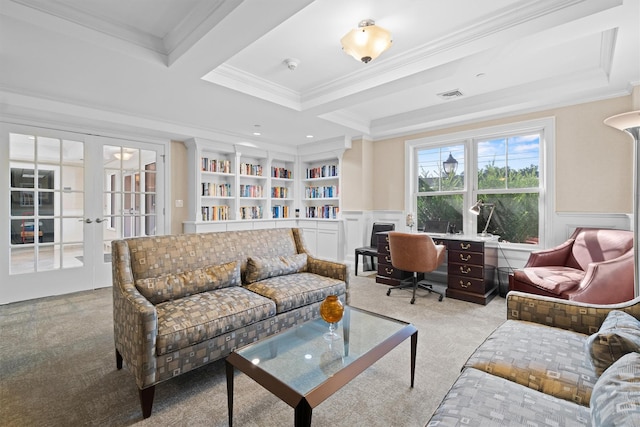 carpeted living room featuring visible vents, ornamental molding, wainscoting, and french doors