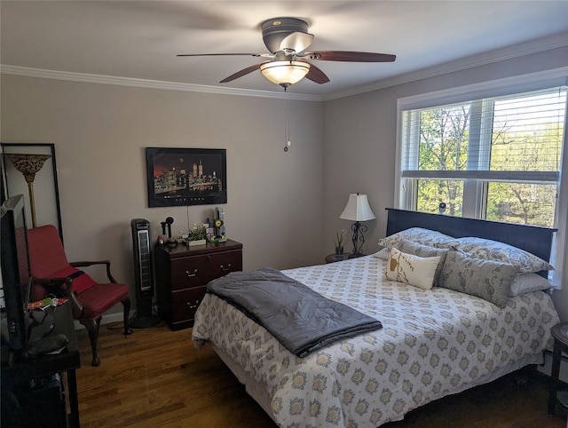 bedroom with crown molding, ceiling fan, and wood finished floors