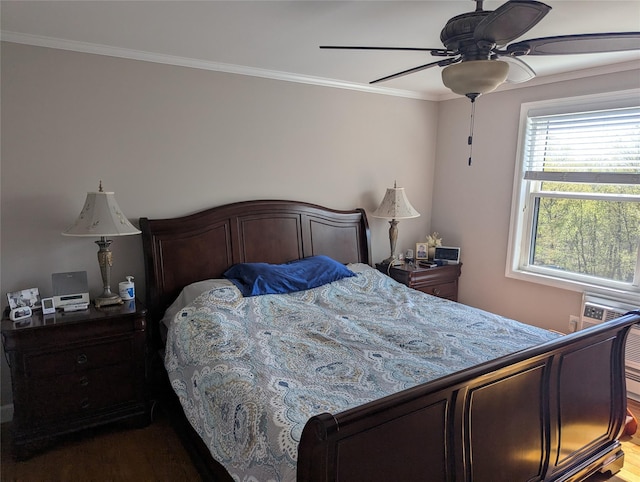 bedroom featuring crown molding, ceiling fan, and wood finished floors