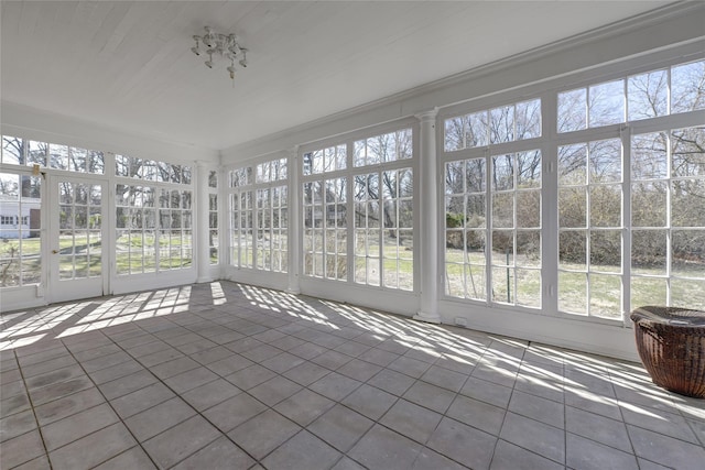unfurnished sunroom featuring french doors and a wealth of natural light