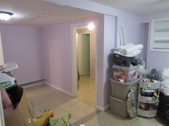 3922 Ely Ave, Bronx, NY 10466 - laundry room featuring light tile patterned floors and a baseboard radiator