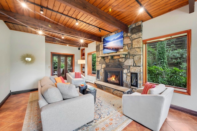 38A Claremont Rd, Scarsdale, NY 10583 - tiled living room with track lighting, wooden ceiling, plenty of natural light, a baseboard heating unit, and baseboards