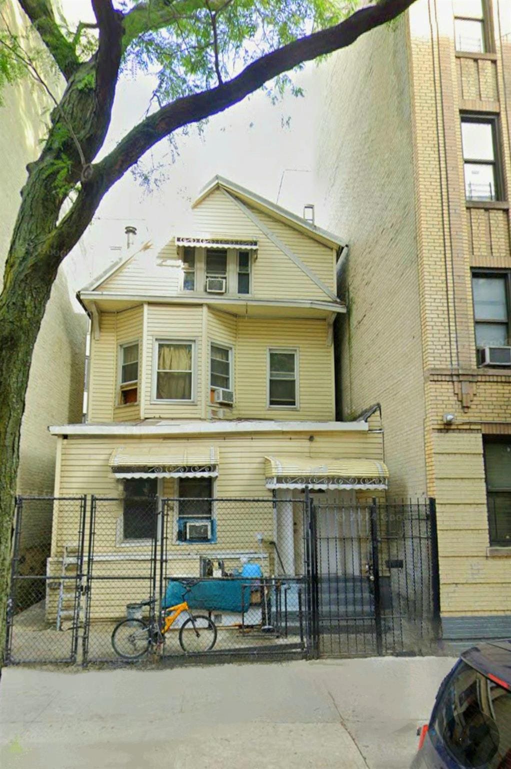back of property featuring fence private yard, a gate, and cooling unit