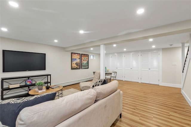 living room featuring baseboards, light wood-style floors, baseboard heating, and recessed lighting