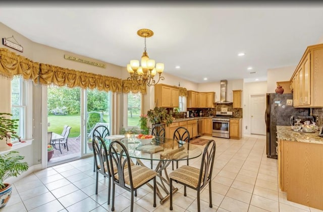 dining area with recessed lighting, a notable chandelier, and light tile patterned floors