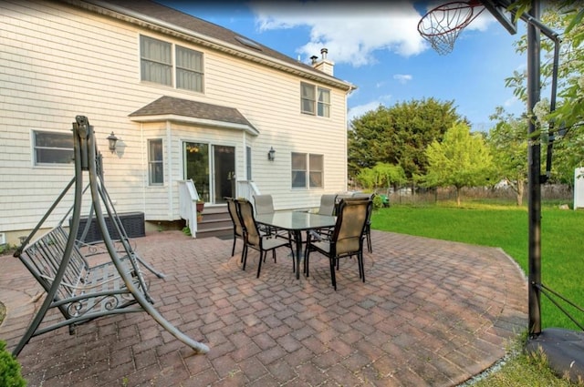 exterior space featuring outdoor dining area and entry steps