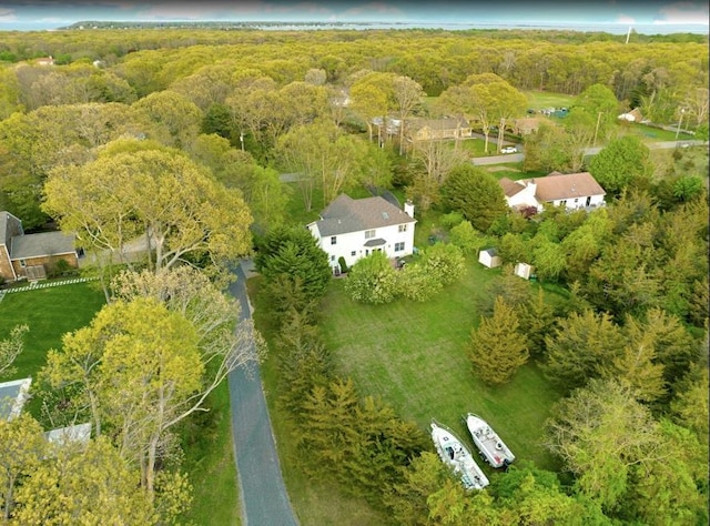 bird's eye view featuring a wooded view