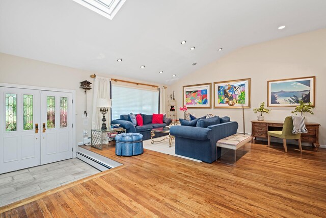 living area with light wood finished floors, recessed lighting, lofted ceiling, and a skylight