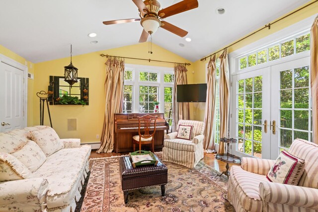 sunroom / solarium with french doors, vaulted ceiling, and a baseboard heating unit