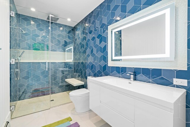 full bath featuring tile walls, a stall shower, toilet, recessed lighting, and tile patterned flooring