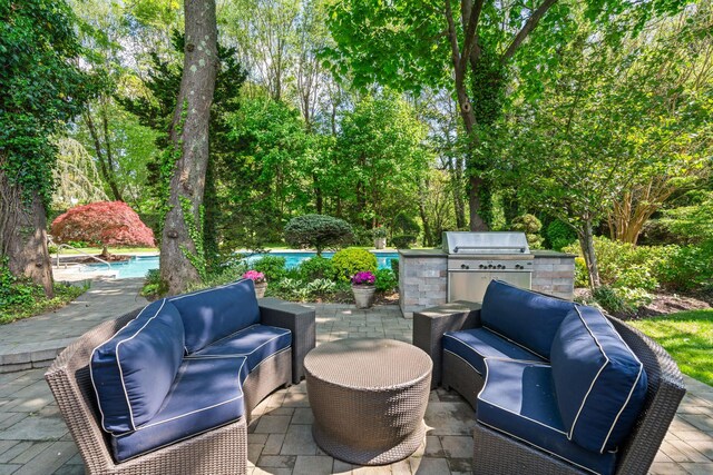 view of patio with an outdoor hangout area, area for grilling, and an outdoor pool