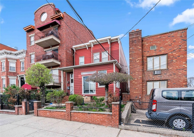 2504 21st St, Astoria, NY 11102 - view of front of home featuring a gate, a fenced front yard, and brick siding