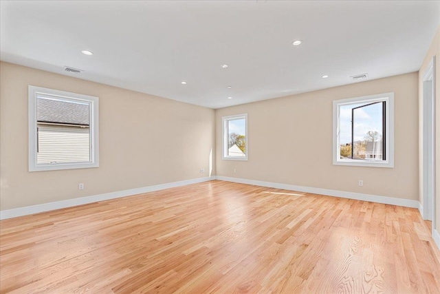 56 Oregon St, Long Beach, NY 11561 - empty room featuring recessed lighting, baseboards, visible vents, and light wood-style floors