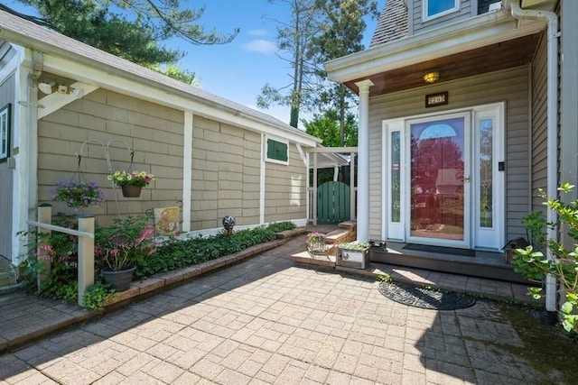 entrance to property featuring a patio area