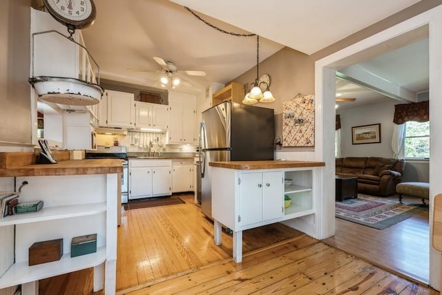 kitchen with open shelves, appliances with stainless steel finishes, light wood finished floors, white cabinetry, and butcher block counters