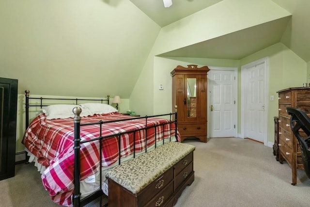 bedroom featuring a ceiling fan, carpet floors, baseboard heating, and vaulted ceiling