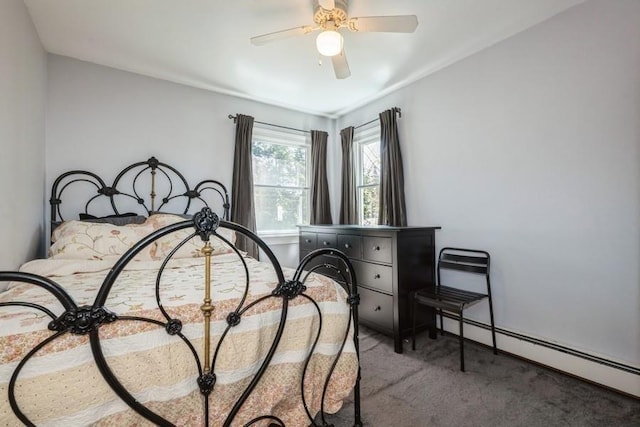 bedroom with carpet floors, ceiling fan, and baseboard heating