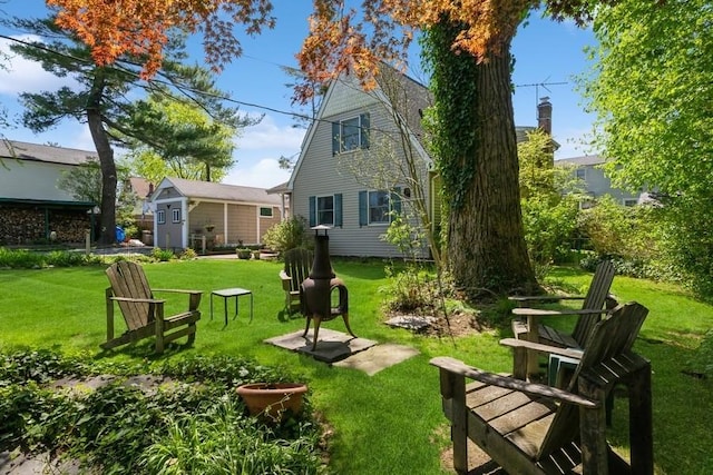 back of property featuring a yard