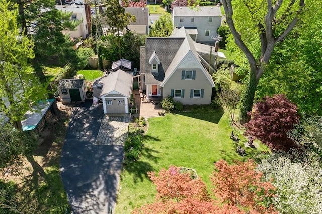 birds eye view of property with a residential view