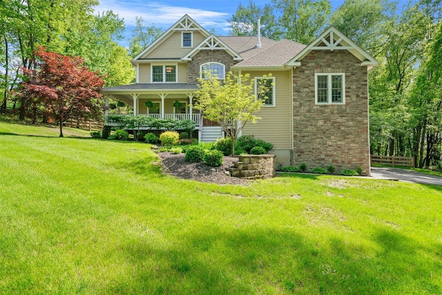 30 Warwick Lake Pkwy, Warwick, NY 10990 - craftsman house with stone siding, covered porch, and a front yard