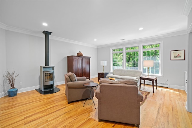 30 Warwick Lake Pkwy, Warwick, NY 10990 - living room with a wood stove, baseboard heating, light wood-style flooring, ornamental molding, and baseboards