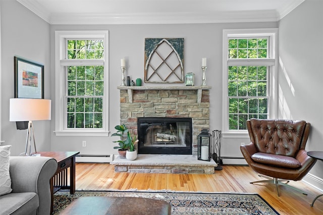 30 Warwick Lake Pkwy, Warwick, NY 10990 - living room featuring a baseboard heating unit, wood finished floors, ornamental molding, and healthy amount of natural light