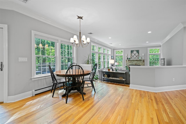 30 Warwick Lake Pkwy, Warwick, NY 10990 - dining room featuring wood finished floors, crown molding, a chandelier, plenty of natural light, and recessed lighting
