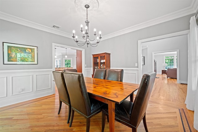 30 Warwick Lake Pkwy, Warwick, NY 10990 - dining space with a chandelier, ornamental molding, wainscoting, light wood-type flooring, and a decorative wall