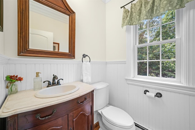 30 Warwick Lake Pkwy, Warwick, NY 10990 - half bath with a wainscoted wall, toilet, healthy amount of natural light, and vanity