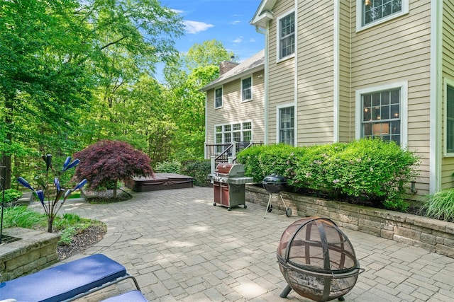 30 Warwick Lake Pkwy, Warwick, NY 10990 - view of patio featuring a hot tub, a fire pit, and grilling area