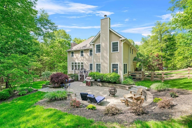 30 Warwick Lake Pkwy, Warwick, NY 10990 - rear view of house with an outdoor fire pit, a chimney, a patio area, and stairway