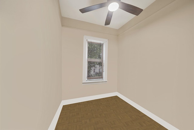 empty room featuring baseboards and ceiling fan