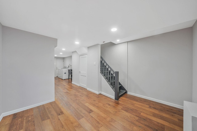 interior space featuring stairs, recessed lighting, baseboards, and light wood finished floors