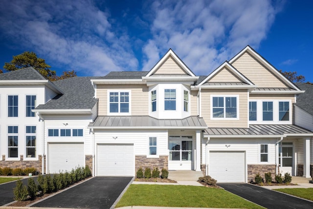 1239 Old Nichols Rd Unit 46, Islandia, NY 11749 - view of property with driveway, stone siding, and a standing seam roof