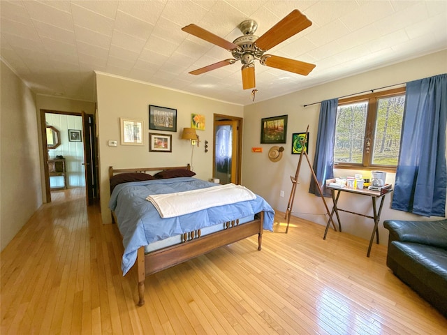 bedroom with a ceiling fan and light wood finished floors