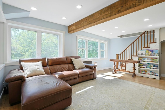 living room with baseboards, plenty of natural light, wood finished floors, recessed lighting, and stairway